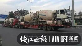 巨無霸來了！半掛車“背”著水泥車欲上高速！